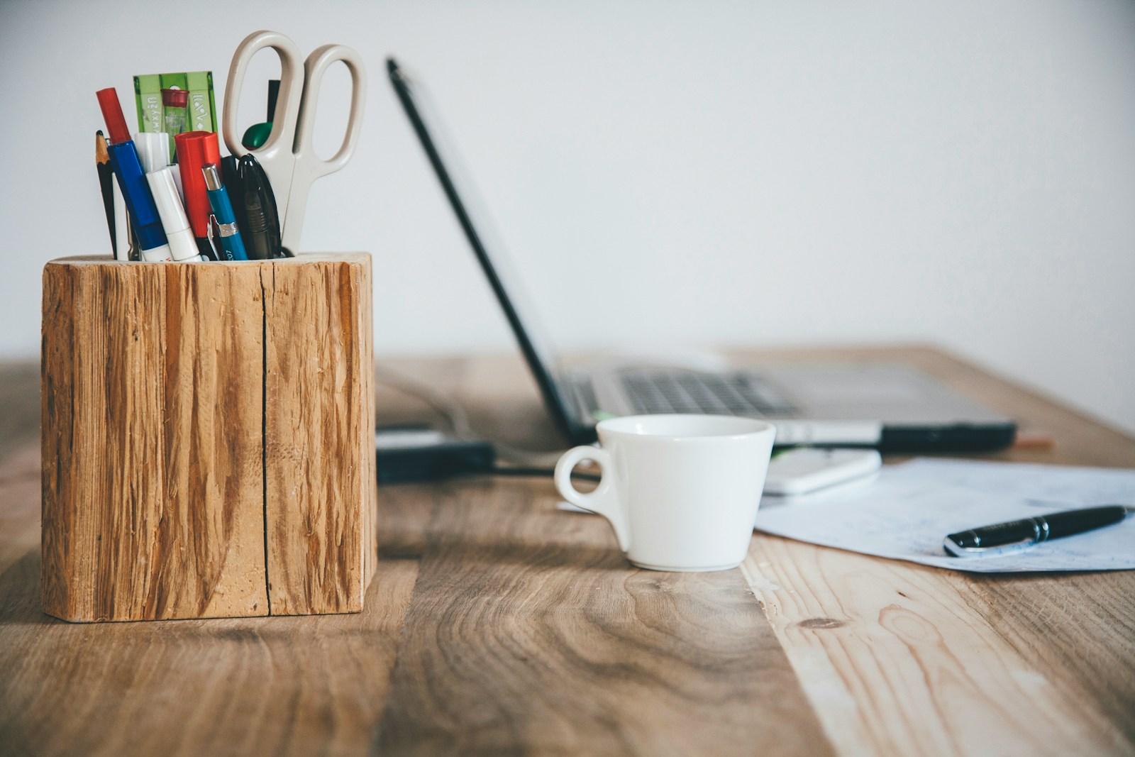 Photo by Markus Spiske white ceramic mug on brown wooden table